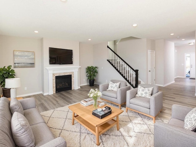 3237 Jandura Ave NE, Saint Michael, MN 55376 - living area featuring light wood finished floors, stairway, recessed lighting, and a fireplace