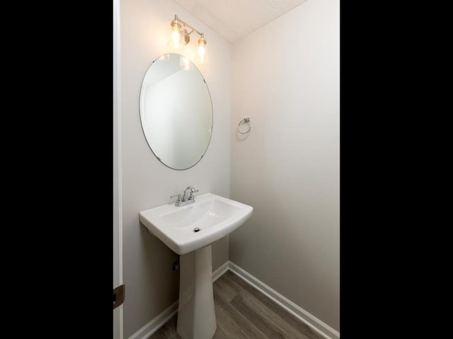 3237 Jandura Ave NE, Saint Michael, MN 55376 - bathroom featuring wood finished floors and baseboards