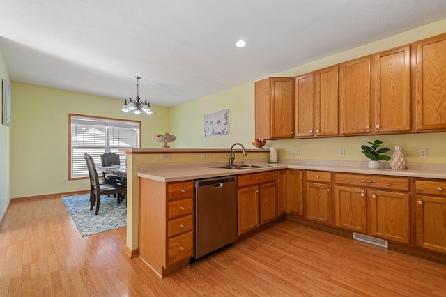 114006 Hundertmark Rd, Chaska, MN 55318 - kitchen with dishwasher, brown cabinets, light countertops, a peninsula, and recessed lighting