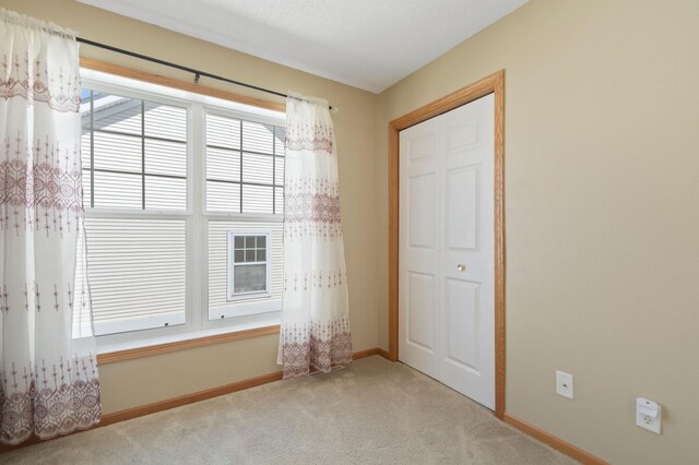 114006 Hundertmark Rd, Chaska, MN 55318 - unfurnished bedroom featuring carpet flooring and baseboards