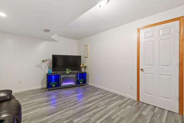 114006 Hundertmark Rd, Chaska, MN 55318 - unfurnished living room with wood finished floors and baseboards