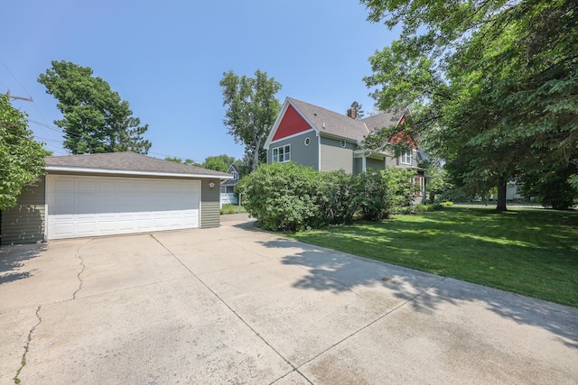 1122 Fillmore St, Alexandria, MN 56308 - view of side of home with a yard and a garage