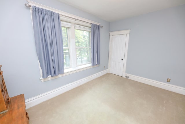 1122 Fillmore St, Alexandria, MN 56308 - carpeted empty room featuring baseboards