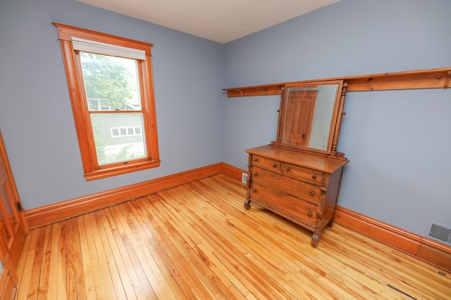 1122 Fillmore St, Alexandria, MN 56308 - unfurnished bedroom with baseboards and wood-type flooring
