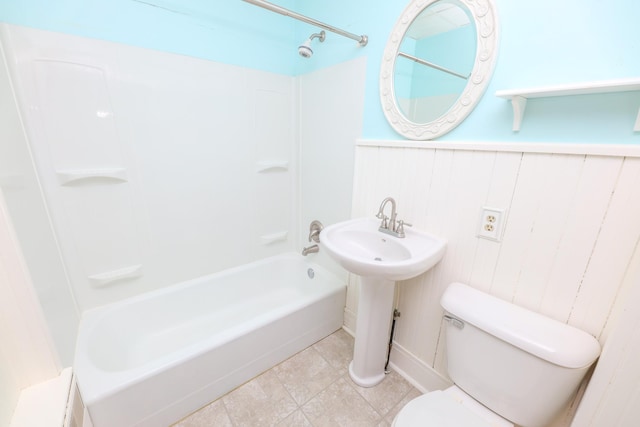 1122 Fillmore St, Alexandria, MN 56308 - bathroom featuring tub / shower combination and wainscoting