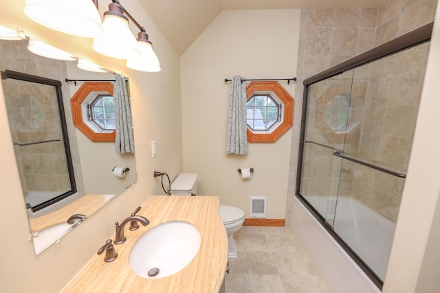 1122 Fillmore St, Alexandria, MN 56308 - bathroom featuring vaulted ceiling, combined bath / shower with glass door, vanity, and tile patterned flooring