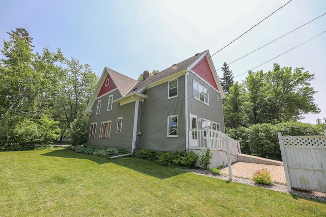 1122 Fillmore St, Alexandria, MN 56308 - view of side of home featuring a chimney