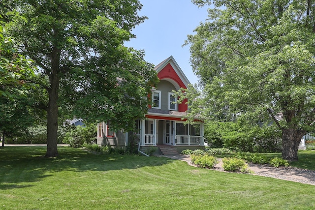 1122 Fillmore St, Alexandria, MN 56308 - victorian-style house featuring covered porch and a front lawn