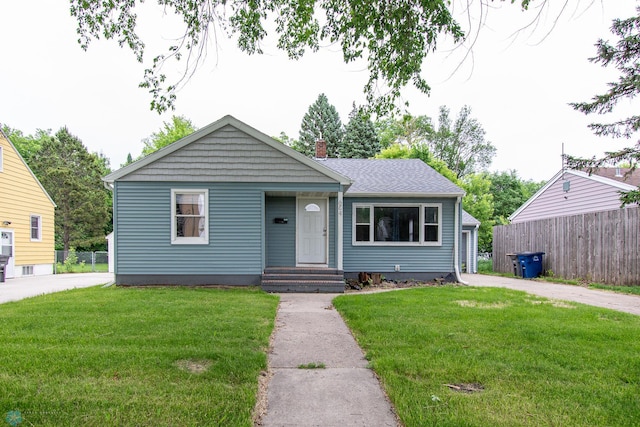 634 11th St N, Moorhead, MN 56560 - bungalow-style home featuring a chimney