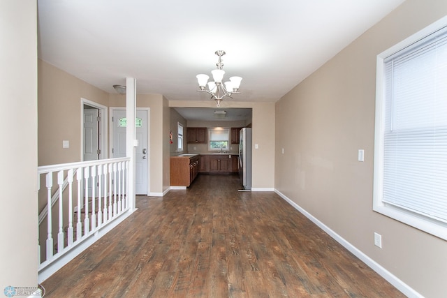 634 11th St N, Moorhead, MN 56560 - interior space with a chandelier and dark wood-type flooring