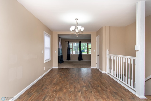 634 11th St N, Moorhead, MN 56560 - unfurnished dining area with a chandelier and wood finished floors