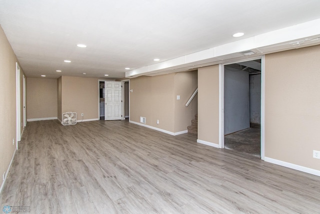 634 11th St N, Moorhead, MN 56560 - finished below grade area featuring recessed lighting, stairs, and wood finished floors
