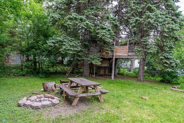 634 11th St N, Moorhead, MN 56560 - view of yard featuring a fire pit and a deck