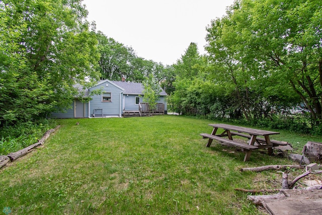 634 11th St N, Moorhead, MN 56560 - view of grassy yard with a deck