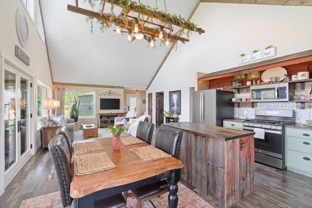 26887 709th St, Lake City, MN 55041 - dining space with high vaulted ceiling, dark wood-style flooring, wood ceiling, a chandelier, and french doors