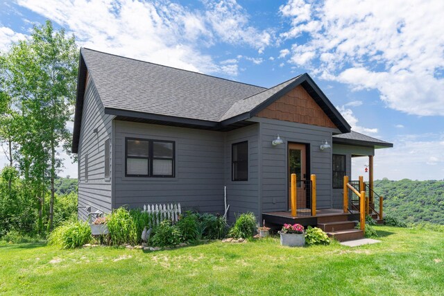 26887 709th St, Lake City, MN 55041 - view of front of house featuring a shingled roof and a front lawn