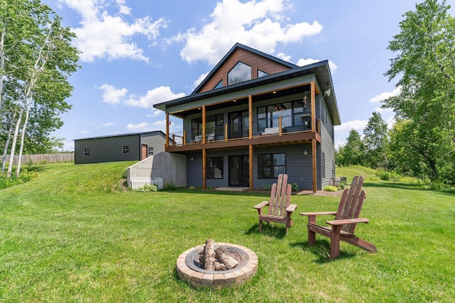 26887 709th St, Lake City, MN 55041 - back of house featuring an outdoor fire pit and a balcony