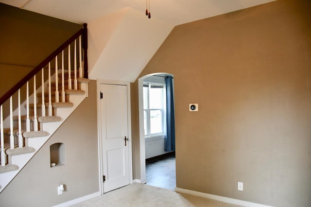 524 Horace Ave N, Thief River Falls, MN 56701 - stairs featuring arched walkways, carpet floors, and vaulted ceiling