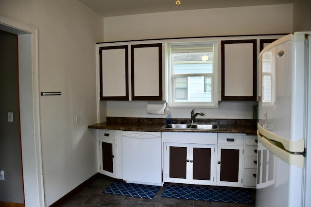 524 Horace Ave N, Thief River Falls, MN 56701 - kitchen with white appliances, dark countertops, and white cabinetry