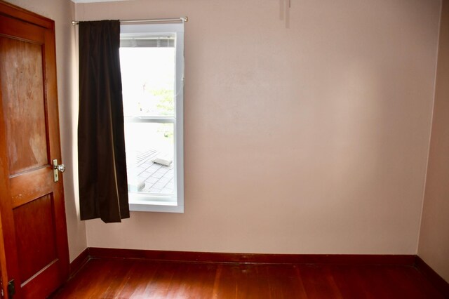 524 Horace Ave N, Thief River Falls, MN 56701 - empty room featuring baseboards and wood finished floors