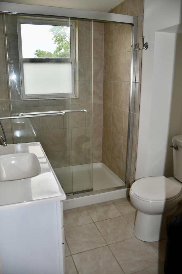 524 Horace Ave N, Thief River Falls, MN 56701 - bathroom featuring vanity, tile patterned floors, and a stall shower
