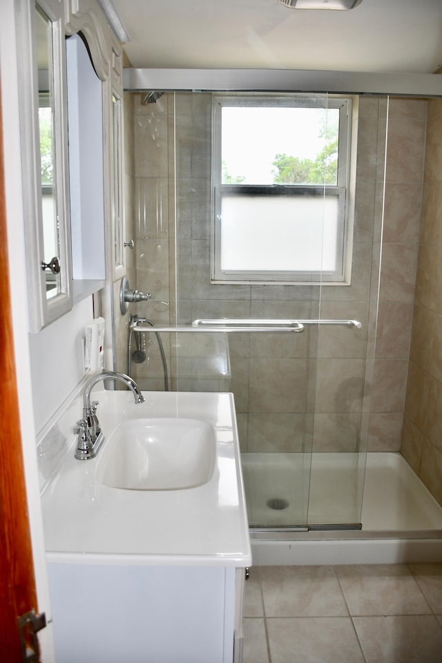 524 Horace Ave N, Thief River Falls, MN 56701 - full bathroom with tile patterned flooring, a stall shower, and vanity