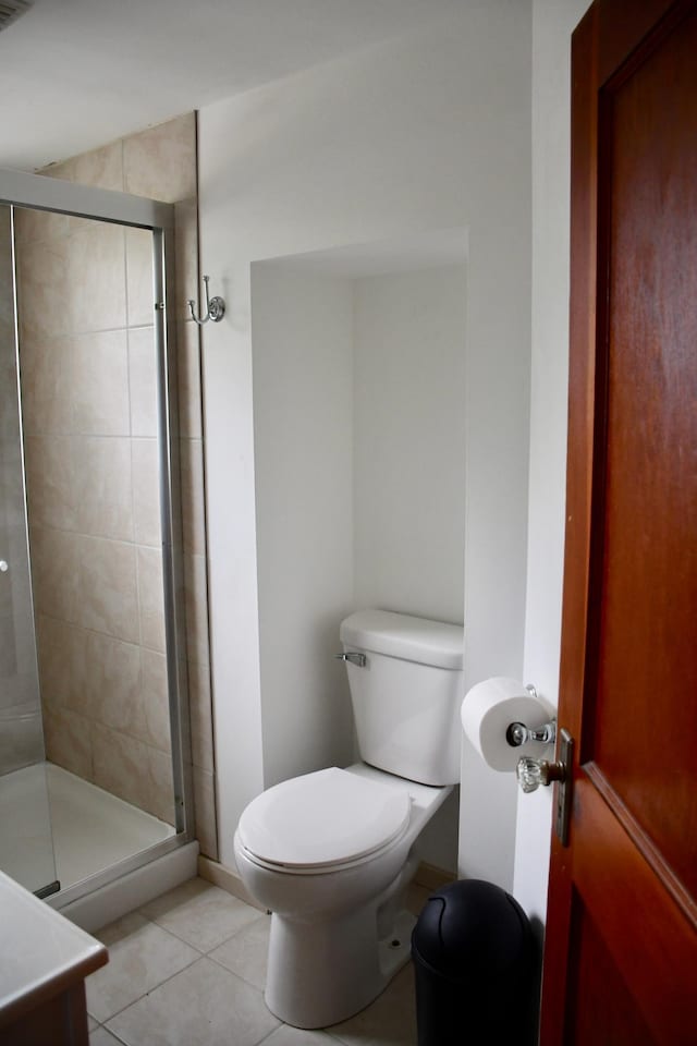 524 Horace Ave N, Thief River Falls, MN 56701 - full bath featuring tile patterned floors, a stall shower, and vanity