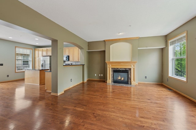 11350 Stratton Ave, Eden Prairie, MN 55344 - unfurnished living room with a high end fireplace, wood finished floors, and recessed lighting