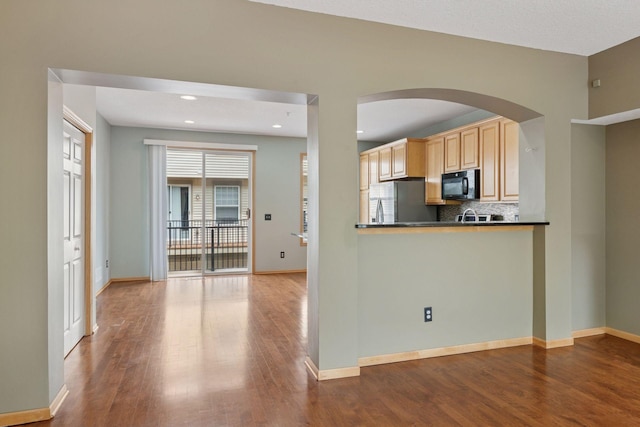 11350 Stratton Ave, Eden Prairie, MN 55344 - kitchen with black microwave, freestanding refrigerator, light brown cabinetry, wood finished floors, and recessed lighting