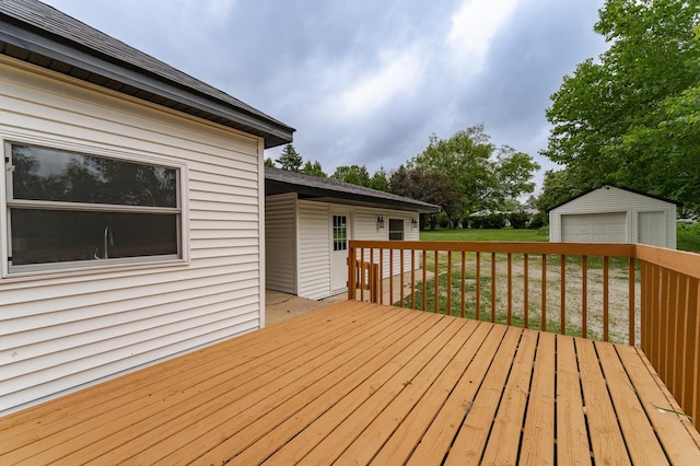 525 Warren Ave, Spring Valley, MN 55975 - wooden terrace featuring a garage, an outbuilding, and a yard