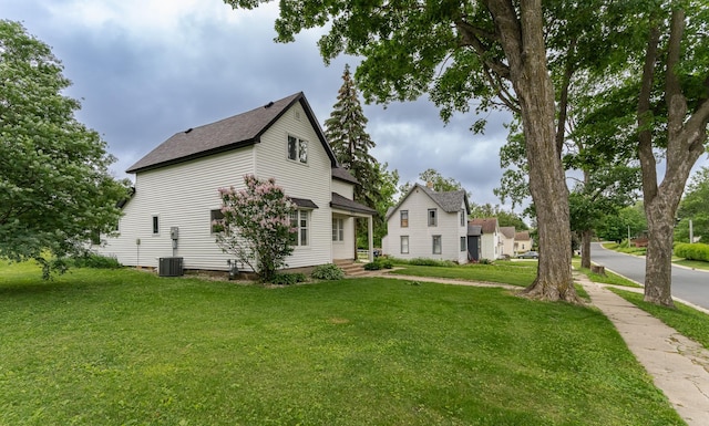 525 Warren Ave, Spring Valley, MN 55975 - view of side of property with a yard and a shingled roof