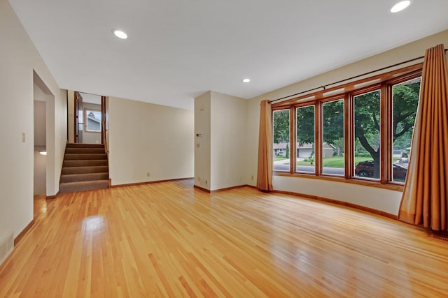 14136 Germane Ave, Apple Valley, MN 55124 - empty room with light wood-type flooring, stairway, and recessed lighting