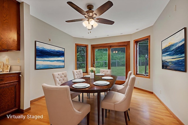 14136 Germane Ave, Apple Valley, MN 55124 - dining room with light wood finished floors and a ceiling fan