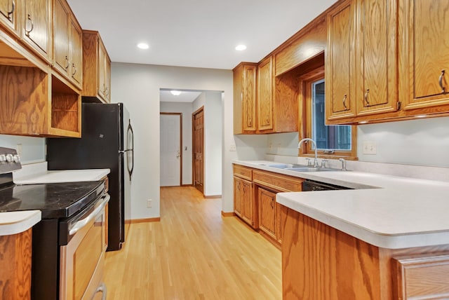 14136 Germane Ave, Apple Valley, MN 55124 - kitchen featuring stainless steel electric range oven, light wood-type flooring, brown cabinets, light countertops, and recessed lighting
