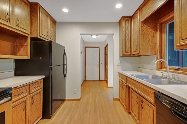 14136 Germane Ave, Apple Valley, MN 55124 - kitchen featuring black appliances, light wood-type flooring, light countertops, brown cabinetry, and recessed lighting