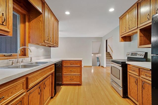 14136 Germane Ave, Apple Valley, MN 55124 - kitchen with electric stove, light wood finished floors, light countertops, brown cabinetry, and recessed lighting