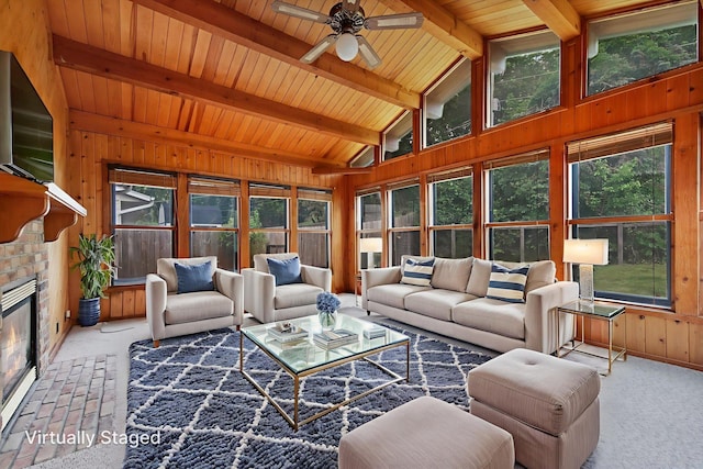 14136 Germane Ave, Apple Valley, MN 55124 - carpeted living room featuring wood walls, healthy amount of natural light, a ceiling fan, wood ceiling, and a fireplace
