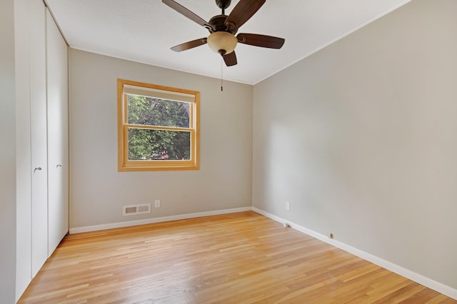 14136 Germane Ave, Apple Valley, MN 55124 - unfurnished room with light wood-style flooring, a ceiling fan, and ornamental molding