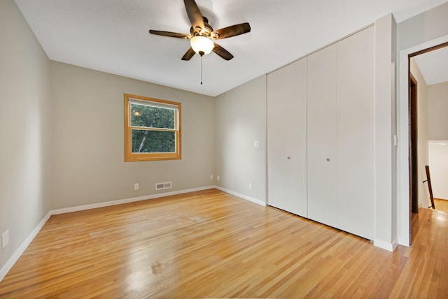 14136 Germane Ave, Apple Valley, MN 55124 - unfurnished bedroom featuring light wood-type flooring, a closet, and ceiling fan