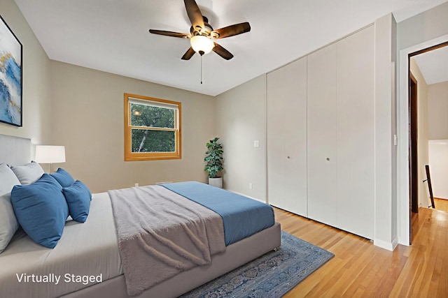 14136 Germane Ave, Apple Valley, MN 55124 - bedroom with light wood-style floors, ceiling fan, and a closet