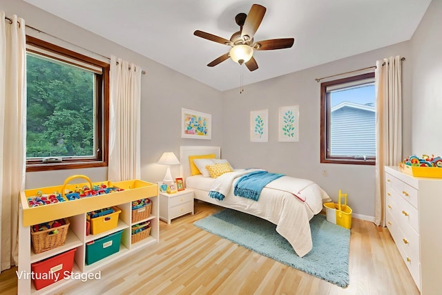 14136 Germane Ave, Apple Valley, MN 55124 - bedroom featuring wood finished floors, multiple windows, and ceiling fan