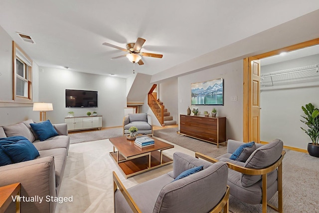 14136 Germane Ave, Apple Valley, MN 55124 - carpeted living area with ceiling fan and stairway