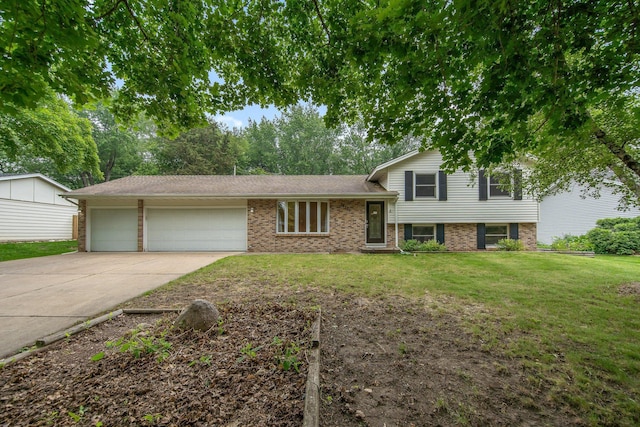 14136 Germane Ave, Apple Valley, MN 55124 - tri-level home with an attached garage, driveway, a front yard, and brick siding