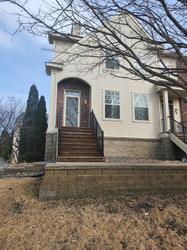 11330 Davenport Cir NE Unit F, Blaine, MN 55449 - view of front of house with a chimney and brick siding