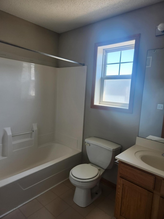 11330 Davenport Cir NE Unit F, Blaine, MN 55449 - full bathroom with tile patterned flooring, vanity, shower / bathtub combination, and a textured ceiling