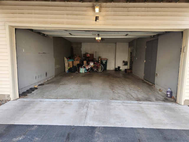 11330 Davenport Cir NE Unit F, Blaine, MN 55449 - garage featuring a garage door opener