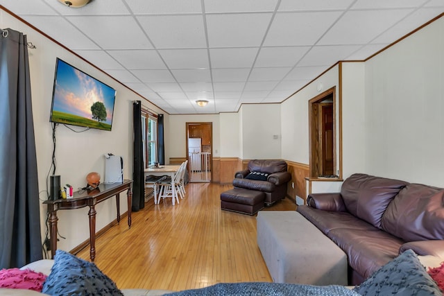 212 31st Ave N, Saint Cloud, MN 56303 - living room featuring a paneled ceiling, light wood finished floors, wainscoting, and wood walls