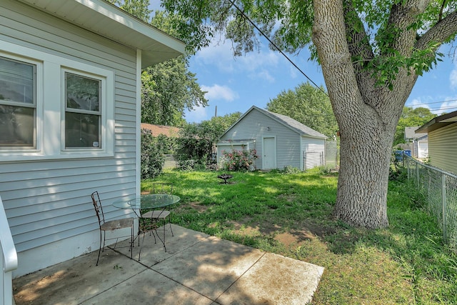 212 31st Ave N, Saint Cloud, MN 56303 - fenced backyard with a patio area and an outdoor structure