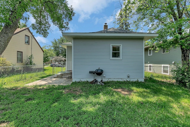 212 31st Ave N, Saint Cloud, MN 56303 - rear view of property with a chimney and a patio