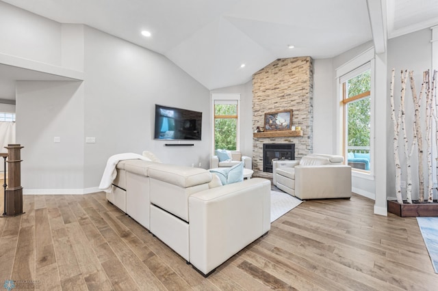 3020 26th Ave S, Fargo, ND 58103 - living room with light wood-style flooring, a fireplace, vaulted ceiling, and recessed lighting